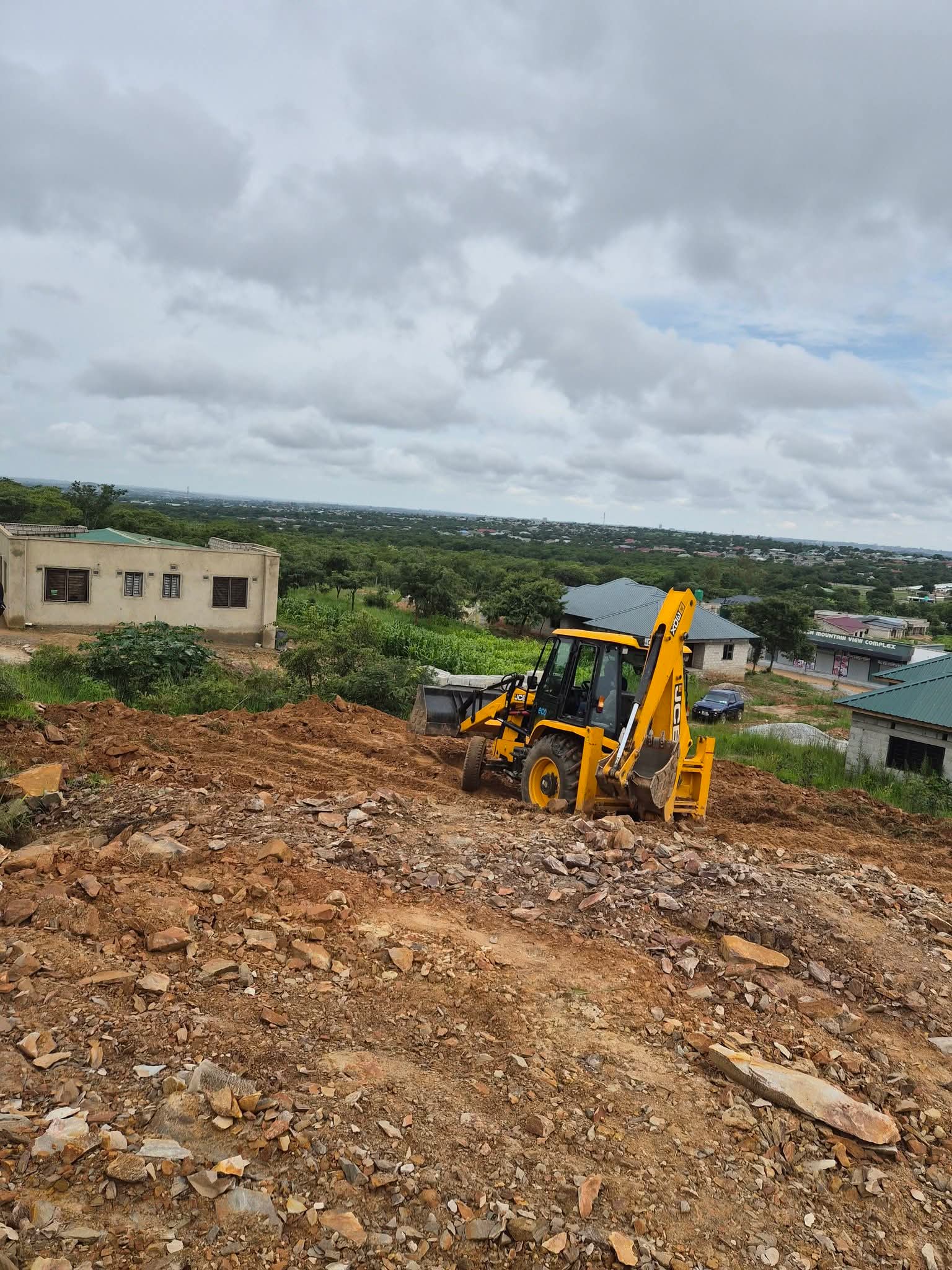 BMR backhoe loader working a hillside site