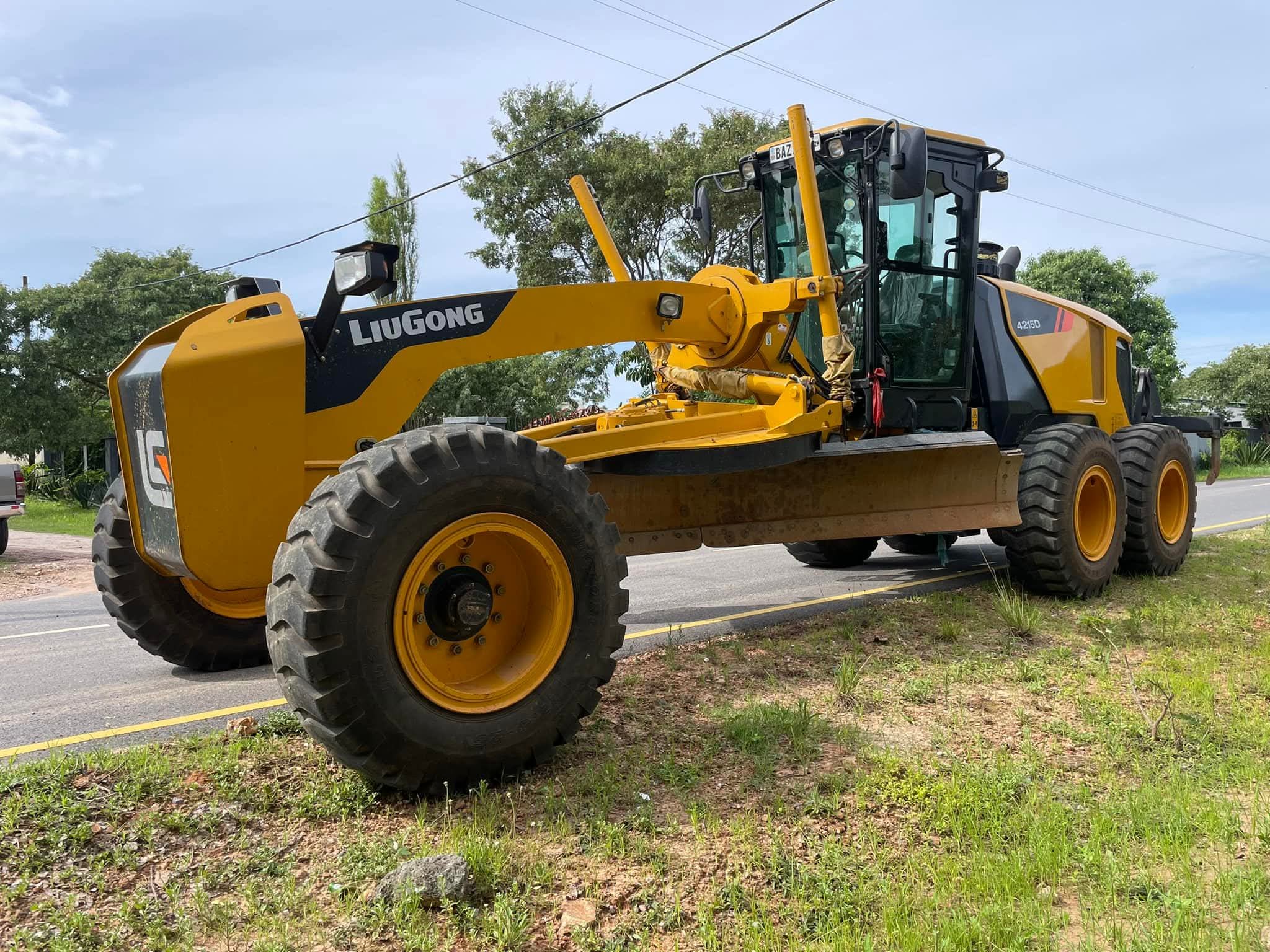 BMR motor grader parked by the road