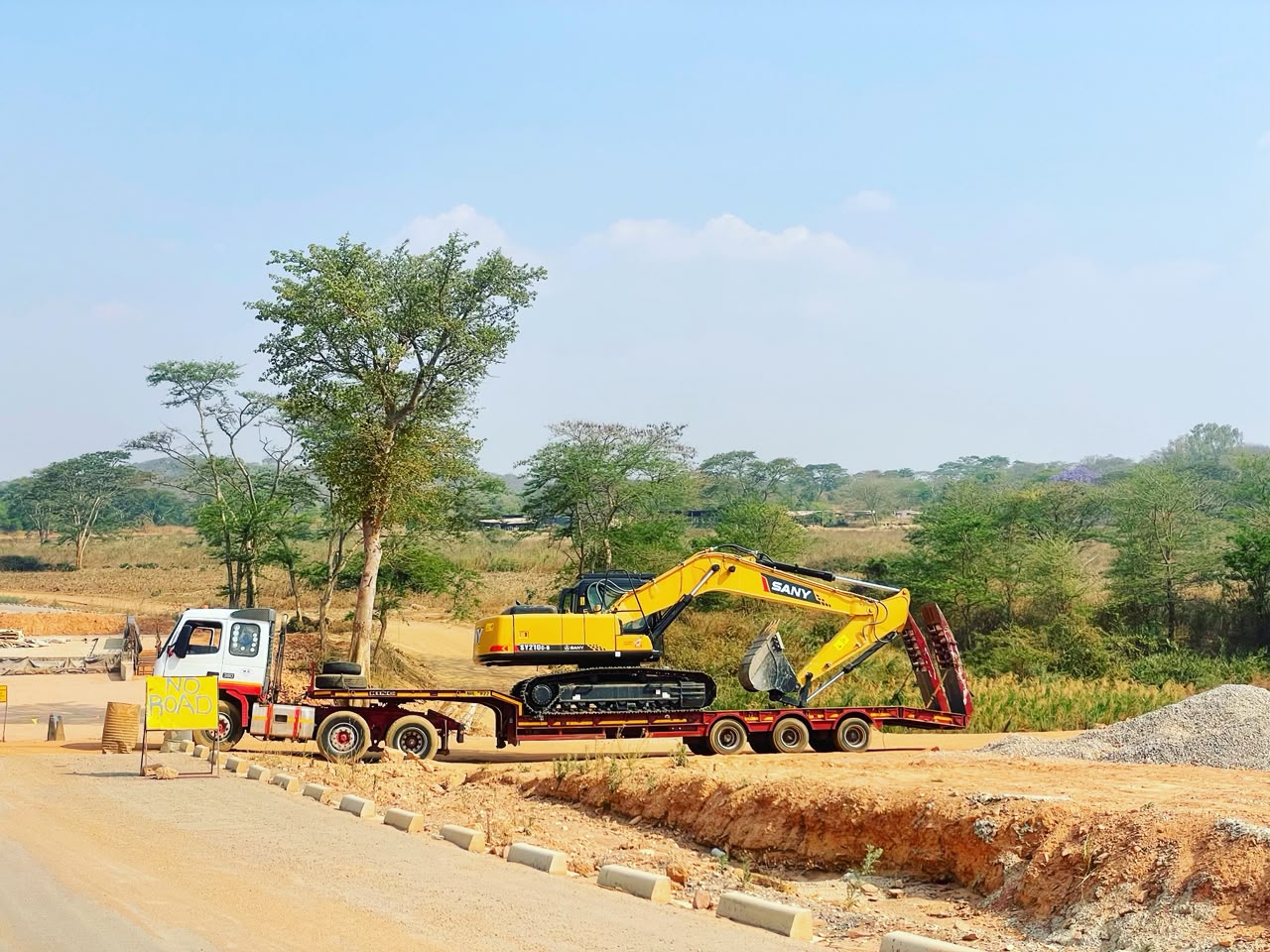 BMR excavator on a lowbed truck